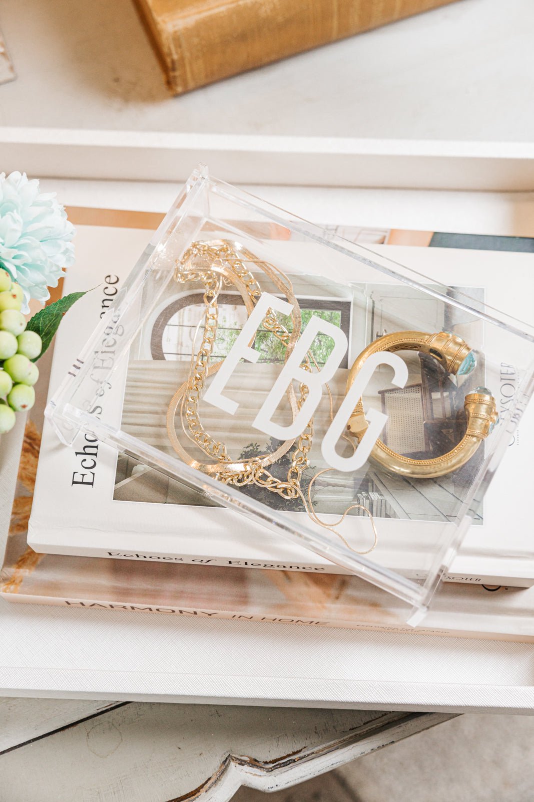 A sleek and modern personalized acrylic tray monogrammed with 'HLT,' perfect for stylish organization and display. This transparent, minimalist design seamlessly complements any home décor, making it an ideal gift or chic storage solution. Pair it with other customized accessories for a cohesive and elegant set.